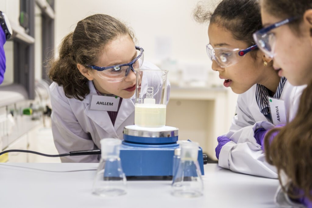 Two girls being curious about chemistry